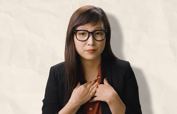 Minh Ngo wearing a red shirt and black jacket